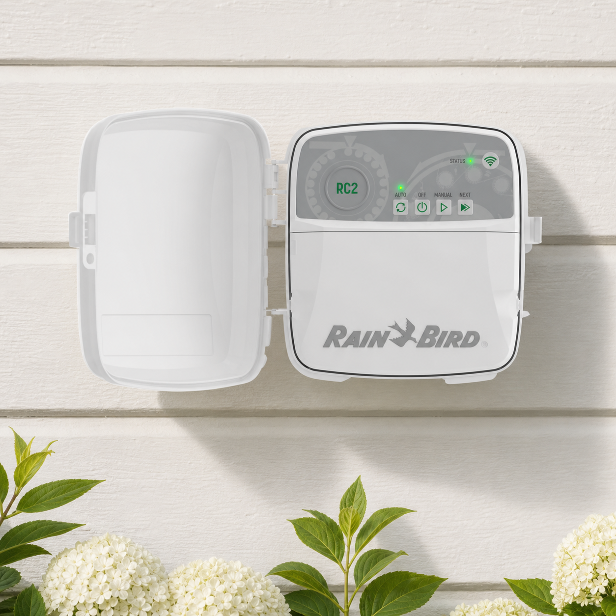 Rain Bird RC2 WiFi smart sprinkler controller mounted on an exterior wall